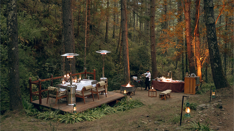 amankora thimphu lodge forest and stream dinner