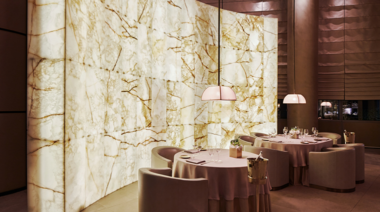 armani ristorante background wall with tables