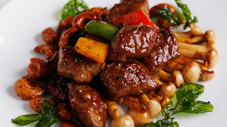 canton table sautéed beef cubes with cashew nuts and basil in BBQ sauce