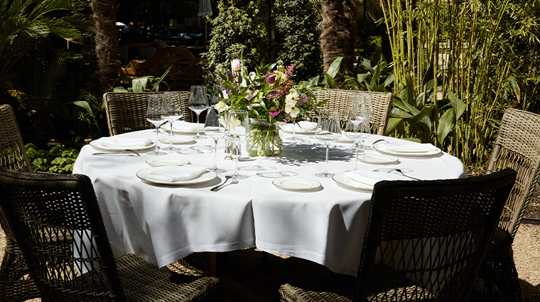 hotel santo mauro autograph collection table in secret garden