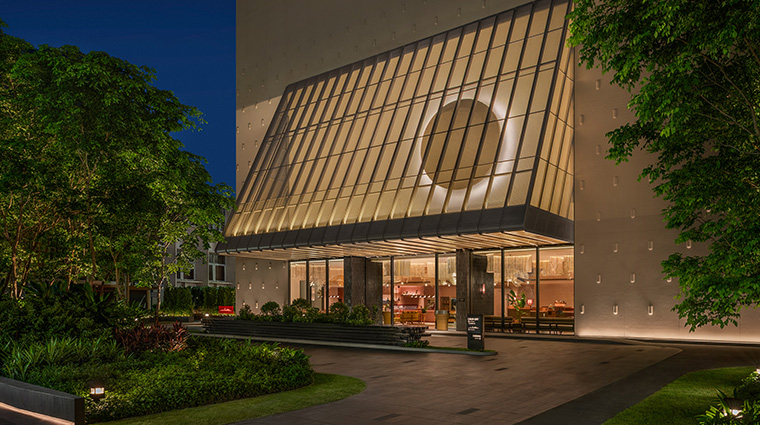 kromo bangkok curio collection by hilton facade twilight