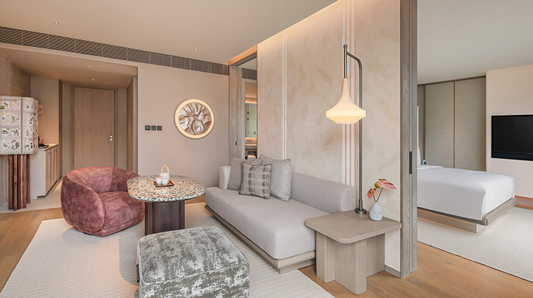 kromo bangkok curio collection by hilton king suite livingroom