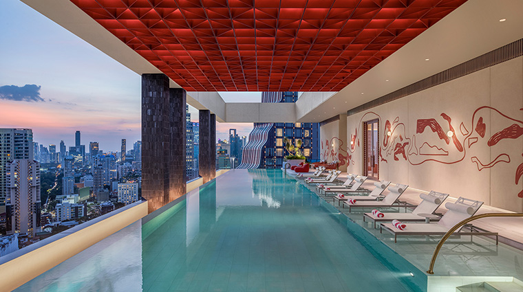 kromo bangkok curio collection by hilton pool twilight