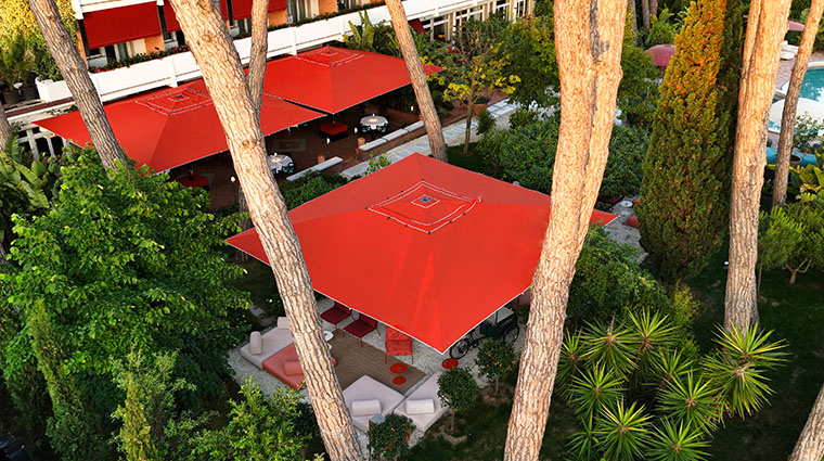 la serena hotel forte dei marmi 20 aerial red parasols pines pool 1