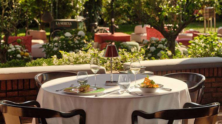 la serena hotel forte dei marmi 49 garden dining table plated food