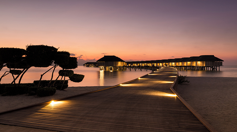 lux south ari atoll water villas sunset
