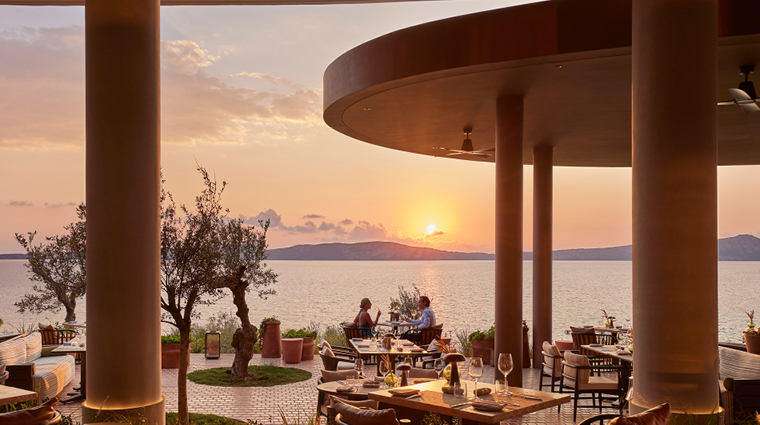 mandarin oriental costa navarino oliviera restaurant couple sunset