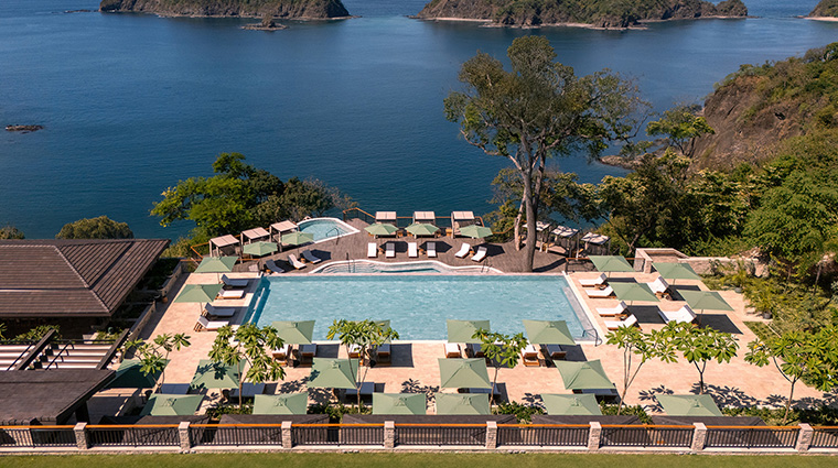 nekajui a ritz carlton reserve pool decs high oblique from lawn islands