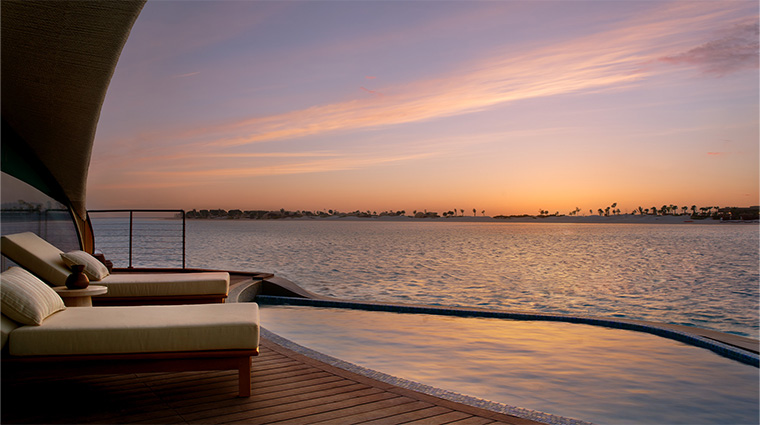 nujuma a ritz carlton reserve overwater villa pool sunset deck