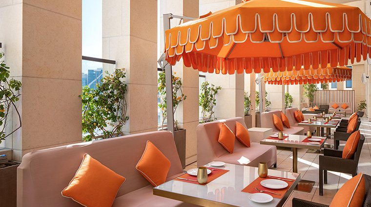park hyatt doha opus restaurant terrace orange umbrellas