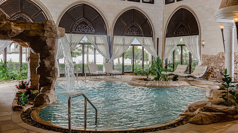sharq village and spa a Ritz carlton hotel indoor pool