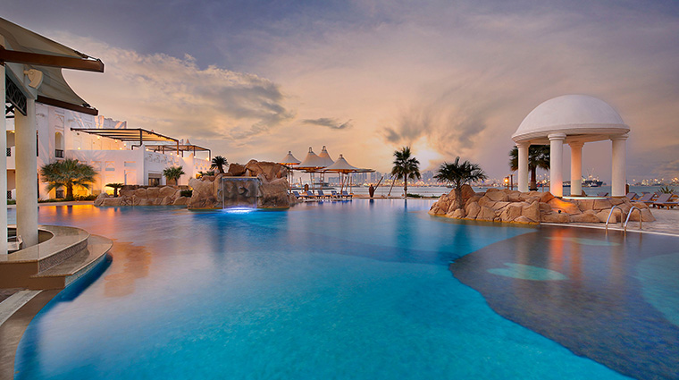 sharq village and spa a Ritz carlton hotel infinity pool