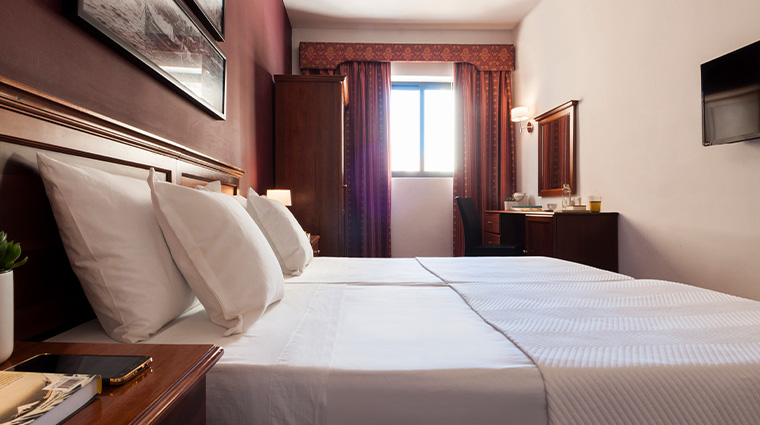 sliema hotel standard room bed