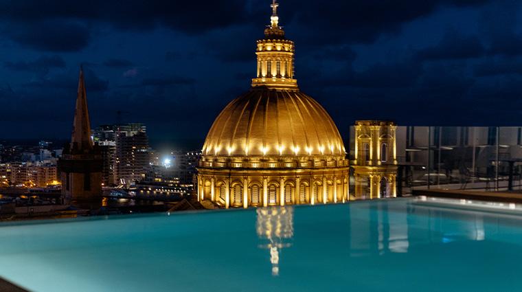 the embassy valletta hotel infinity rooftop pool night