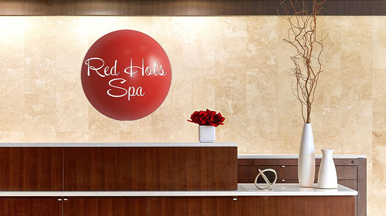 the garden city hotel red hots spa signage