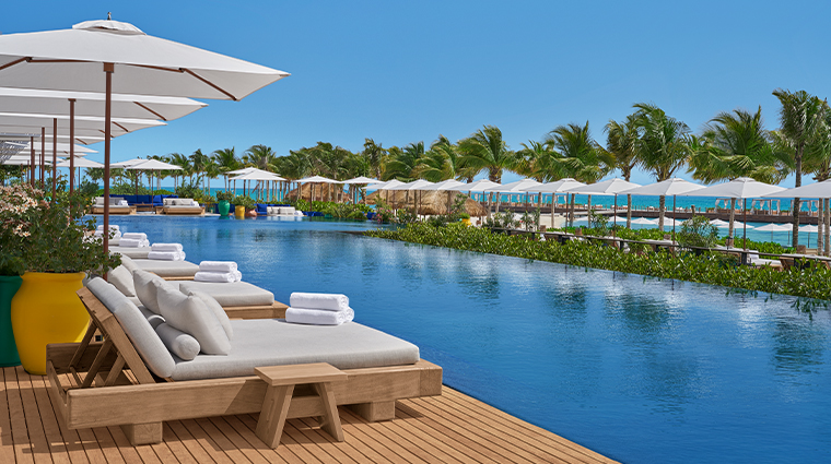 the riviera maya edition at kanai beach club pool sunbeds
